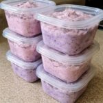 Creamy mixed berry fluff with strawberries, raspberries, and blueberries in a dessert bowl.
