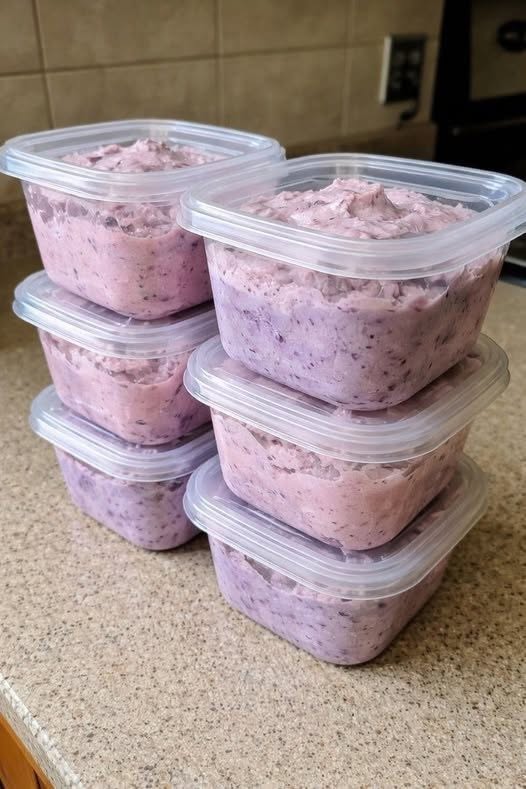 Creamy mixed berry fluff with strawberries, raspberries, and blueberries in a dessert bowl.