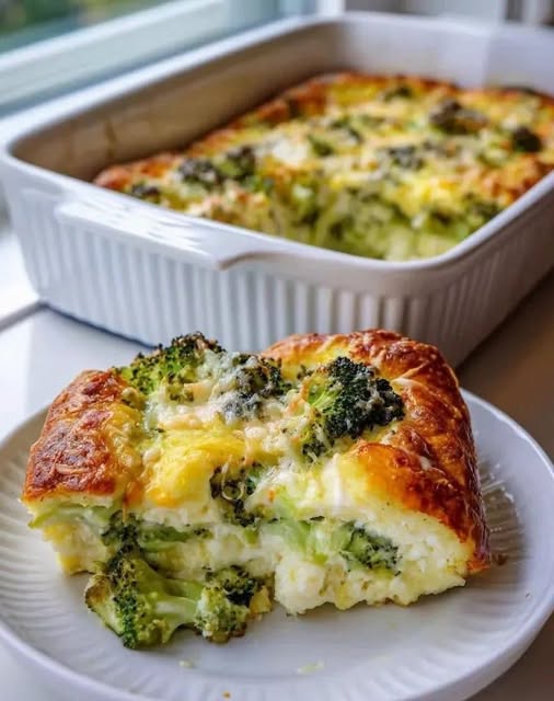 Golden broccoli and cauliflower cottage cheese bake with a thick square serving on a white plate.