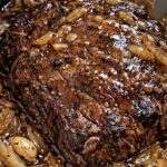 Slow Cooker Garlic Butter Beef Roast with Caramelized Onions and Rich Brown Gravy