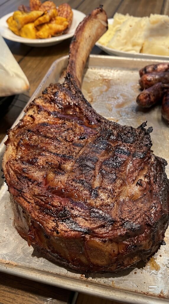 Grilled Tomahawk Ribeye Steak with Garlic Herb Butter